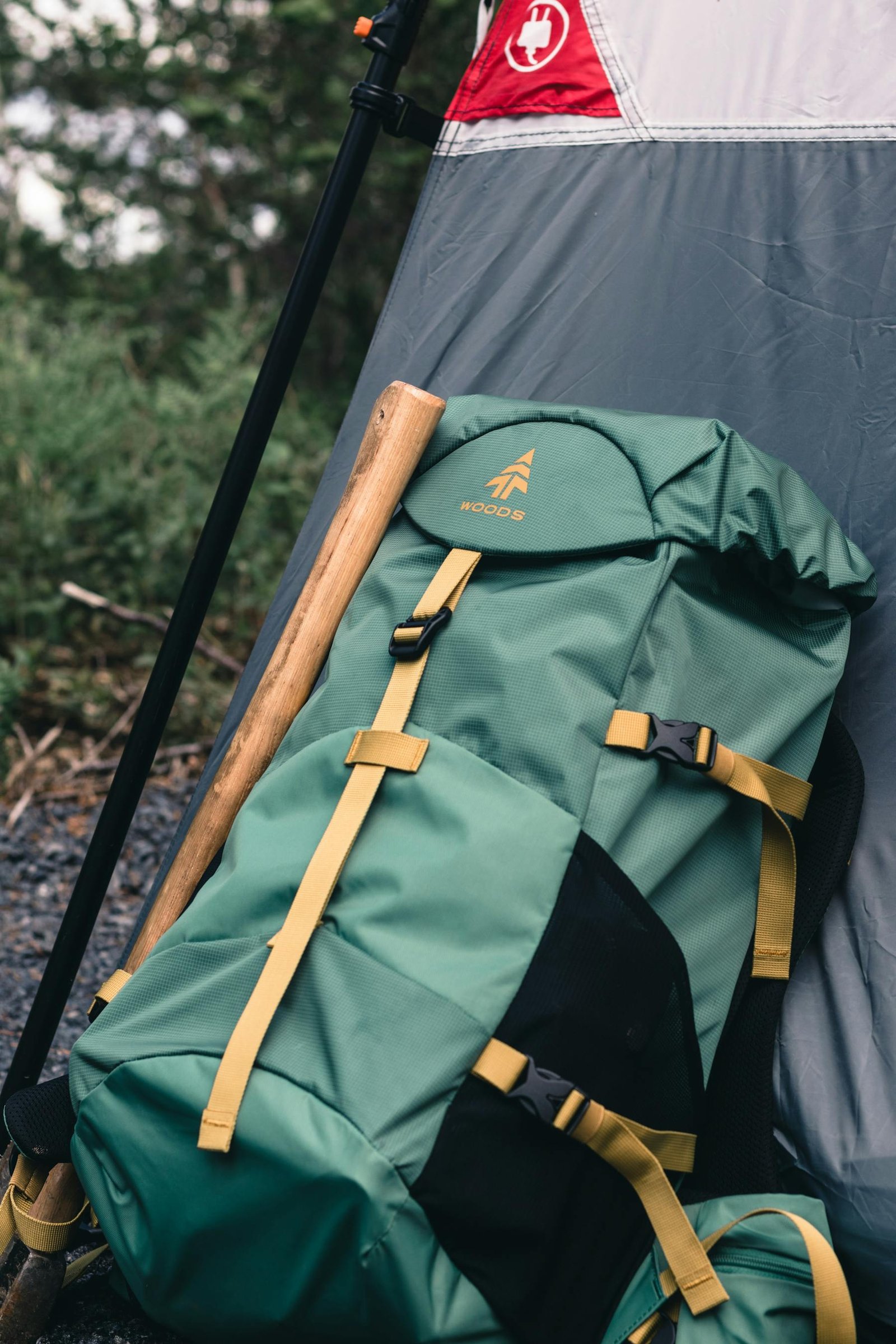 Backpack beside a campsite tent